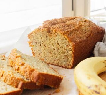 A few ripe bananas and a dusting of cinnamon beside it.